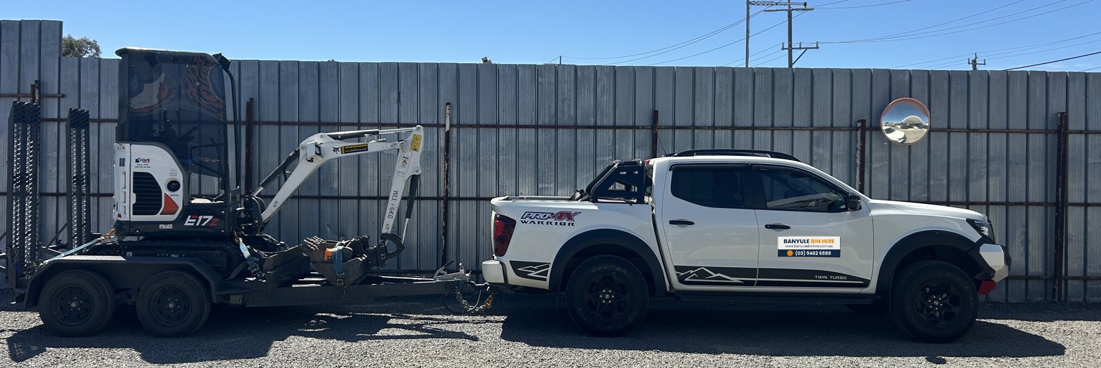 Ute towing a trailer with a 1.7 tonne mini excavator