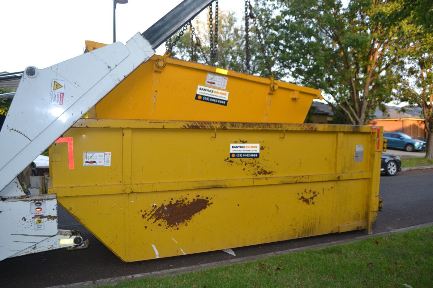 Banyule Bin Hire truck lifting a large skip bin